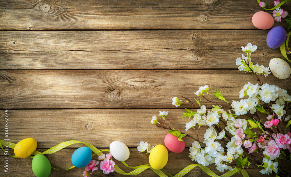 Fototapeta premium Easter background with colorful eggs and spring flowers