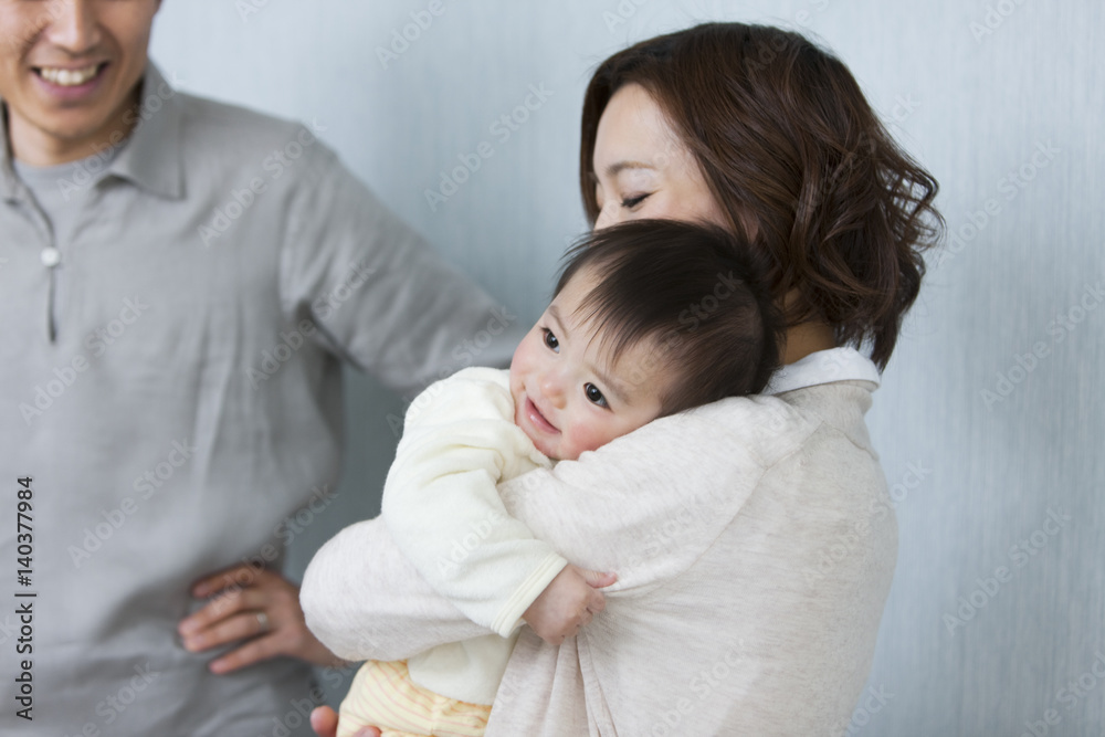 Mother carrying baby Mother carrying baby