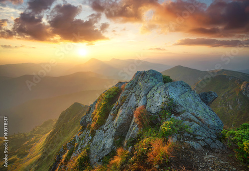 Mountain valley during bright sunset. Beautiful natural landscape in the summer time