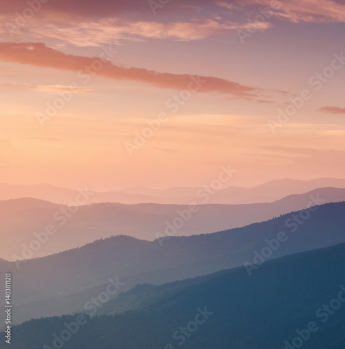 Mountain valley during sunrise. Natural landscape in the summer time