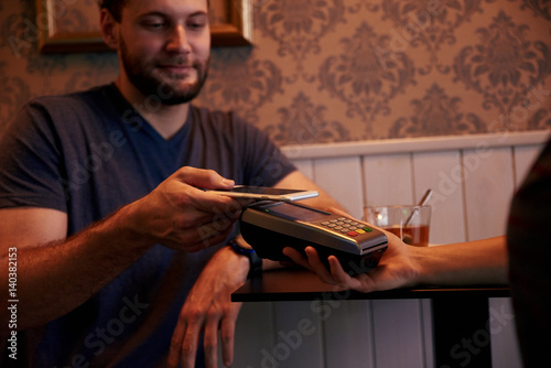 Man offering to pay his check