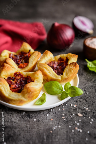 Red onion and sun-dried tomato mini tartlets
