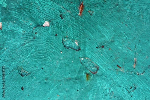 Old iron surface painted in turquoise color.