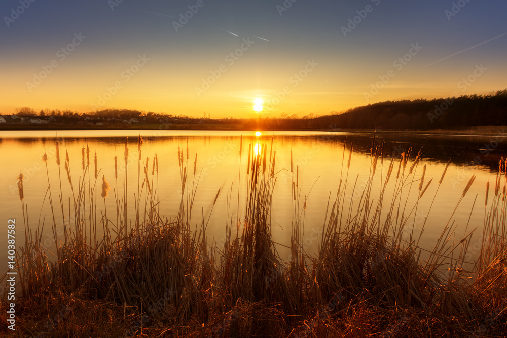 sundown at the pond with sunrays