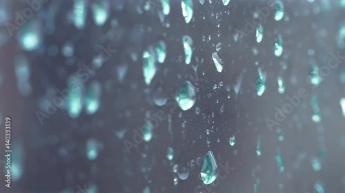 High quality video of rain drops on the window in 4K photo