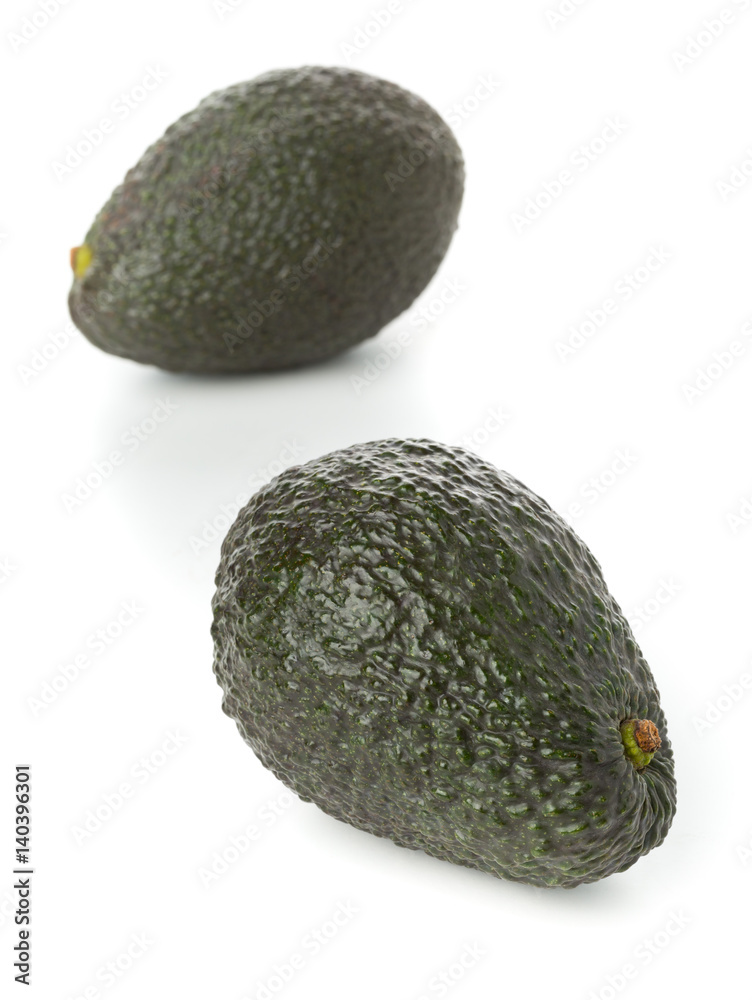 Two whole, uncut ripe avocado fruit Two whole, uncut ripe avocado fruit
