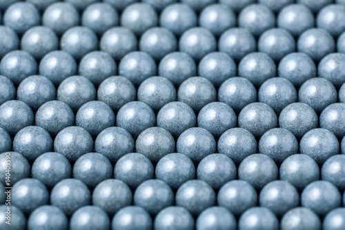 background of gray airsoft balls of 6mm