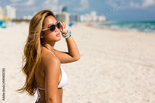 Beautiful asian woman in white bikini on beach vacation holiday