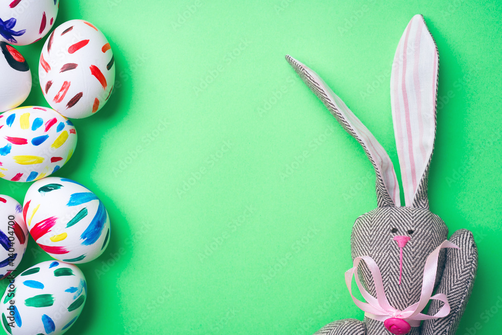 Easter eggs in a green background. Easter bunny. Rabbit. Easter ideas. Easter eggs. Space for text.