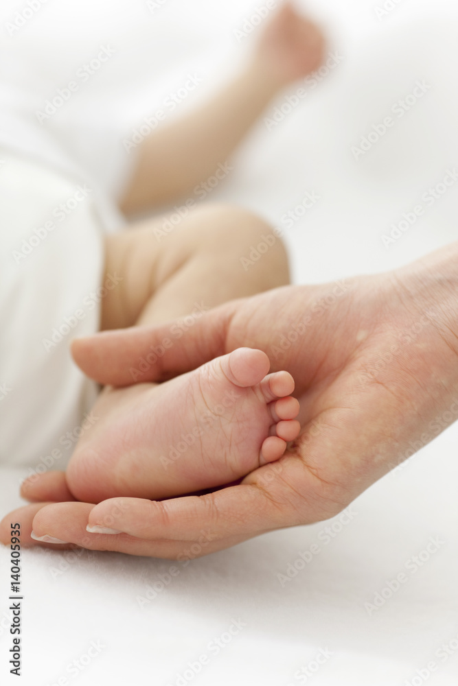 Mother Holding Baby's Foot Mother Holding Baby's Foot