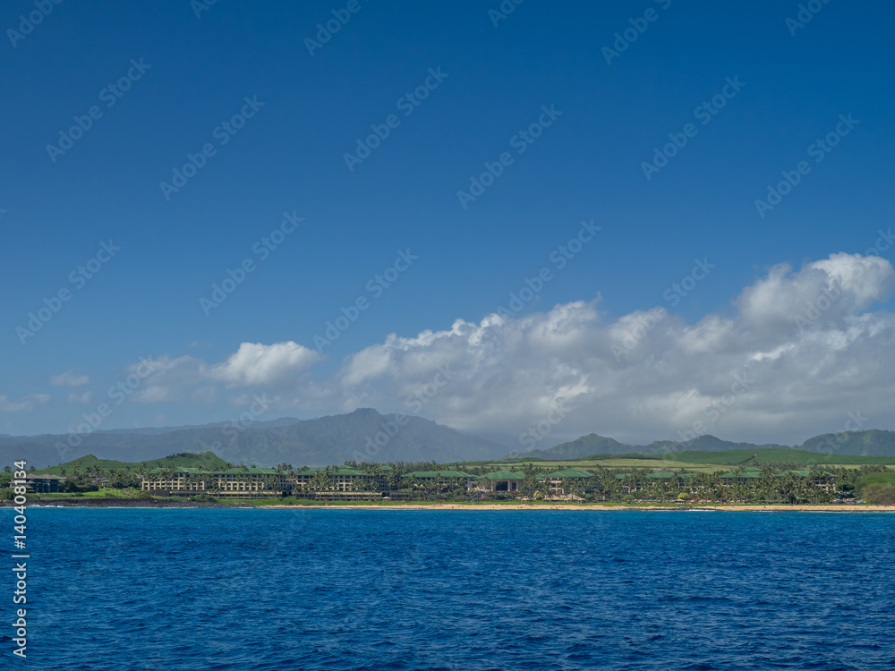 View of famous Poipu beach on Kauai from the ocean. 