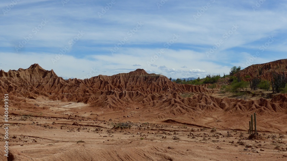 Fototapeta premium Landscape view of dark red fragile soil that's been heavily eroded in the Tatacoa desert in Colombia.