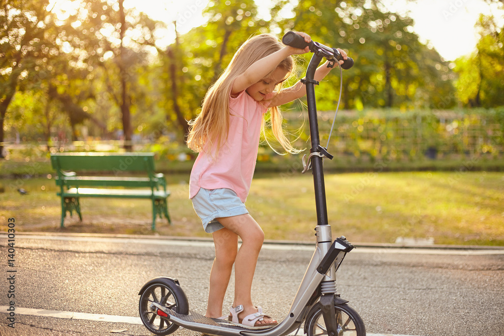 Playing with scooter Stock-Foto | Adobe Stock