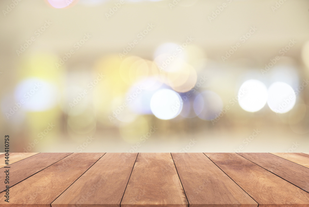 Blurred bokeh light background and Wooden table  
