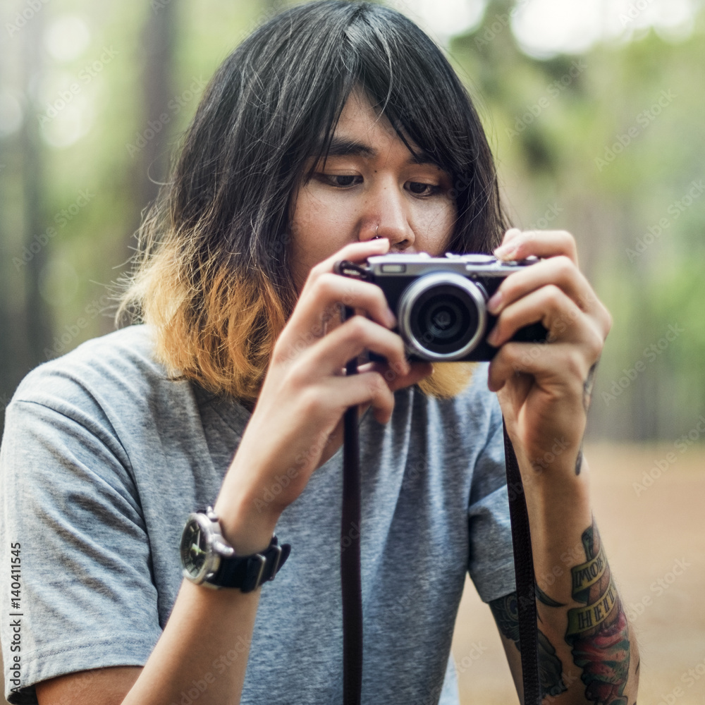 Asian Photographer Taking Pictures Outdoors Concept Asian Photographer Taking Pictures Outdoors Concept