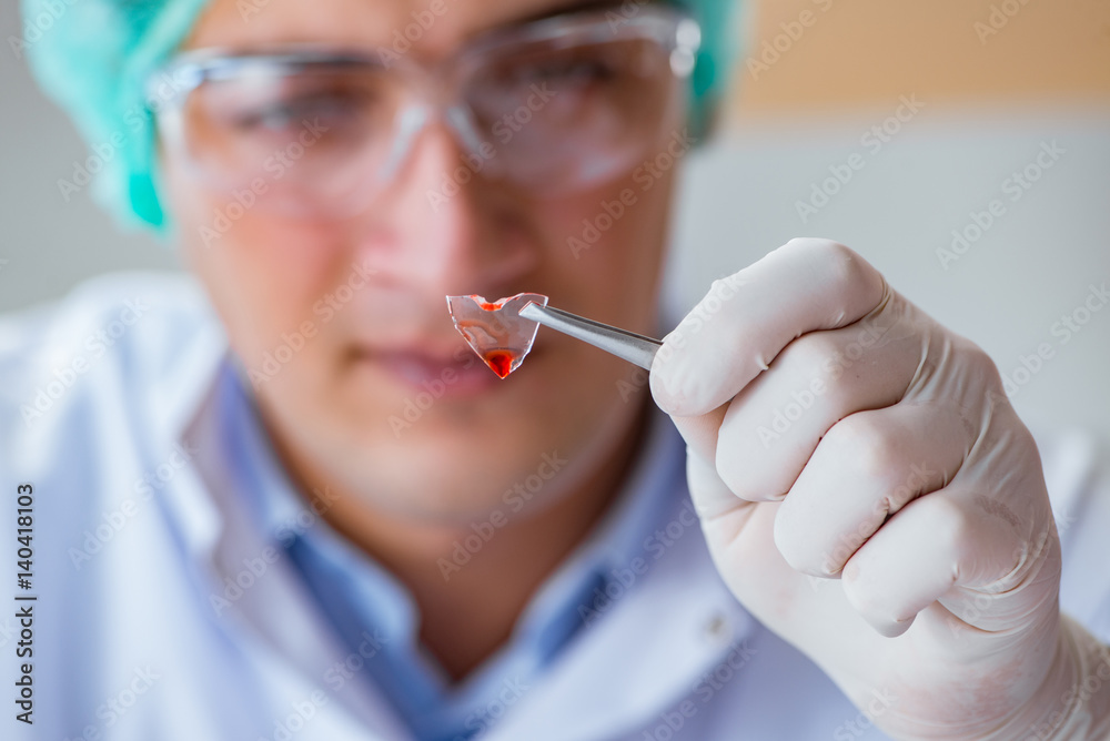 Young doctor working on blood test in lab hospital Young doctor working on blood test in lab hospital