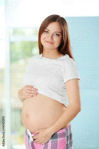 Pregnant woman holding her tummy Free Download Pregnant woman holding her tummy - GFXLoad