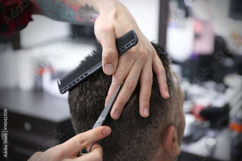 Barber making modern male h...