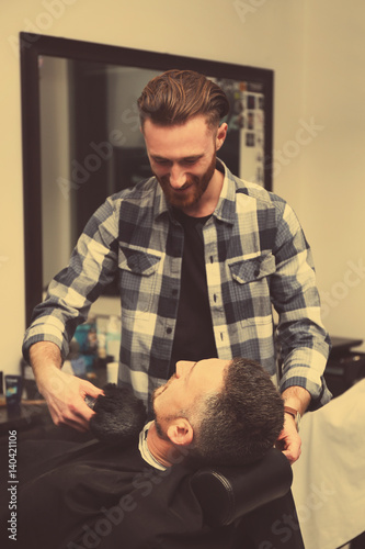 Hairdresser taking care of ...