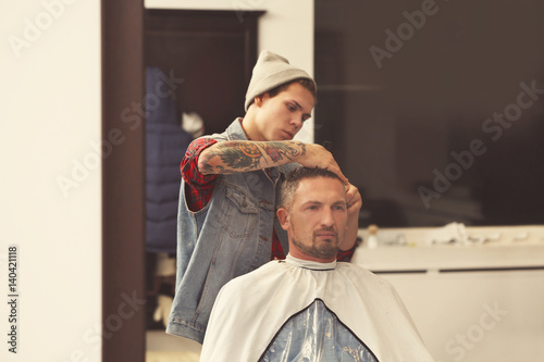 Barber making modern male h...