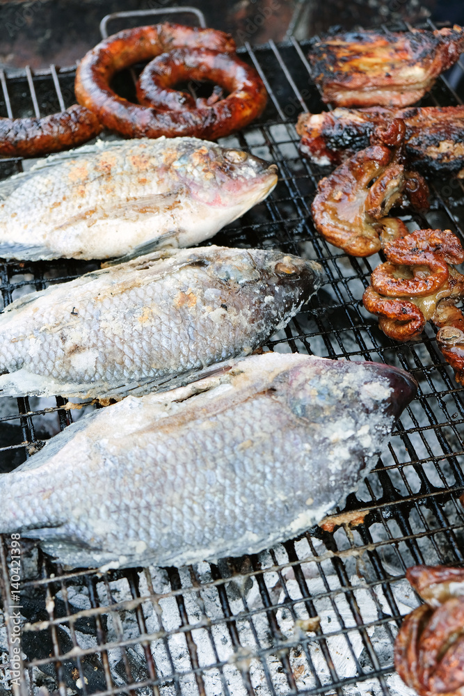Salt-Crusted Grilled Fish,Thai dessert,street food. In Thailand it is a standard food of the northern provinces and it has become very popular in the rest of Thailand as well.