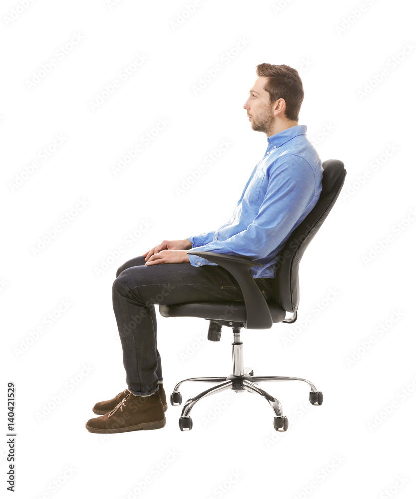 Incorrect posture concept. Man sitting on chair isolated on white Incorrect posture concept. Man sitting on chair isolated on white