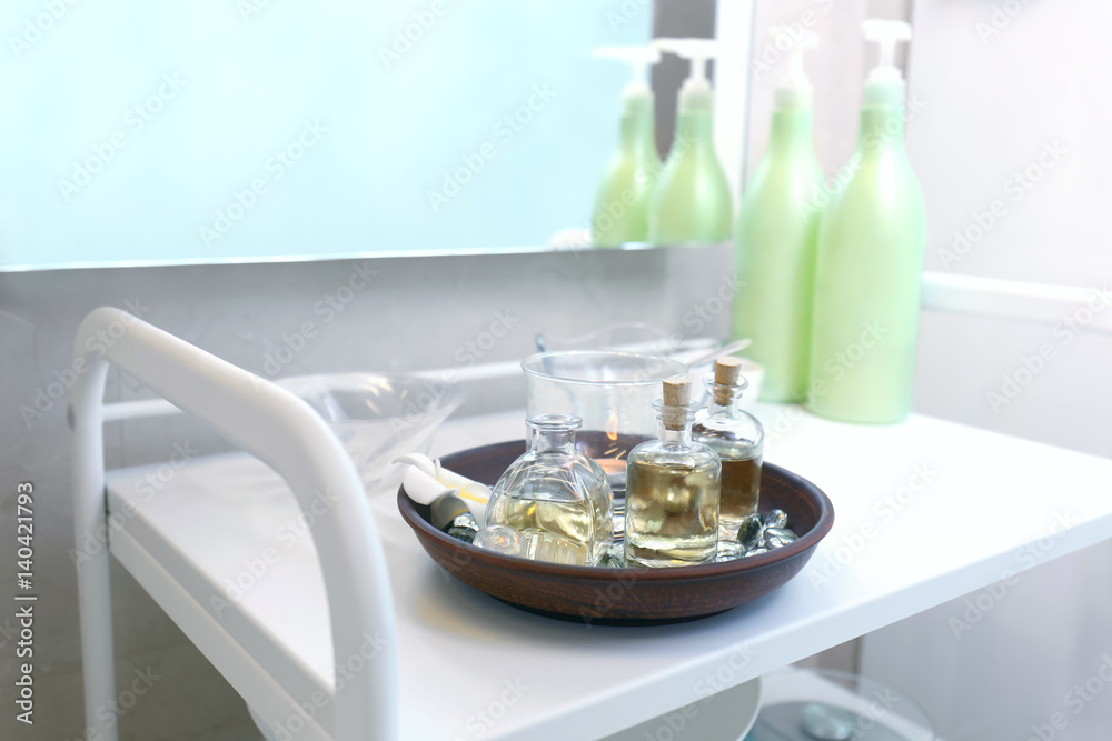 Fototapeta premium Set of essential oils in modern spa salon