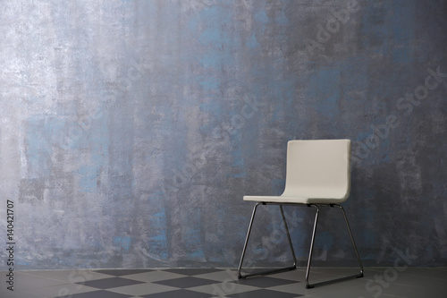 Chair on grey wall background