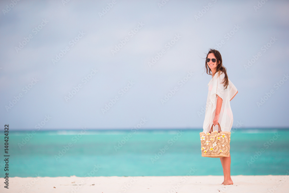 Young beautiful woman during tropical beach vacation Young beautiful woman during tropical beach vacation