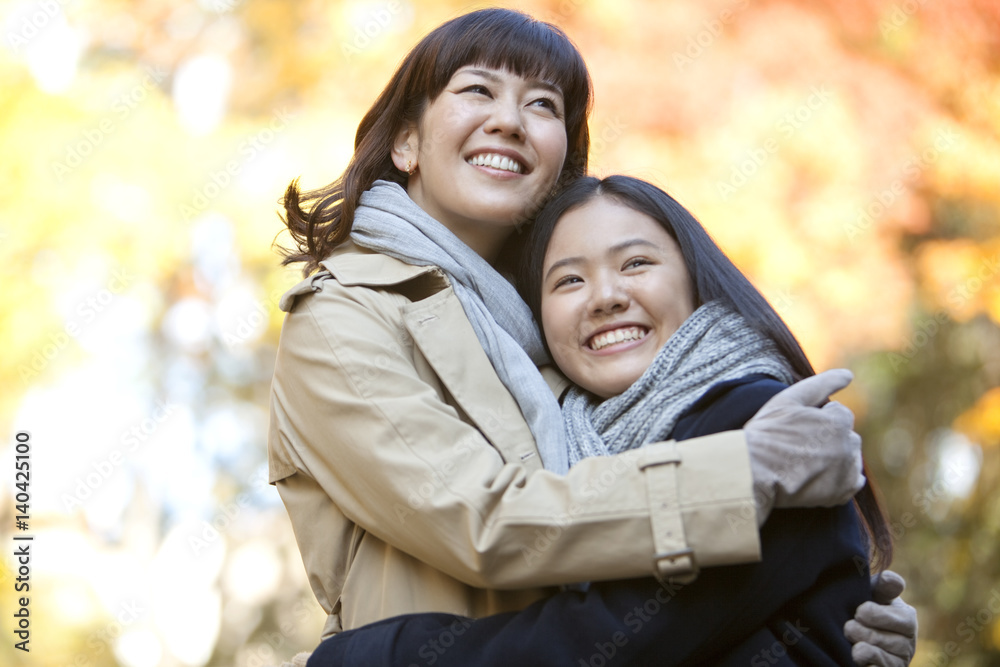 Mother and daughter hugging Mother and daughter hugging