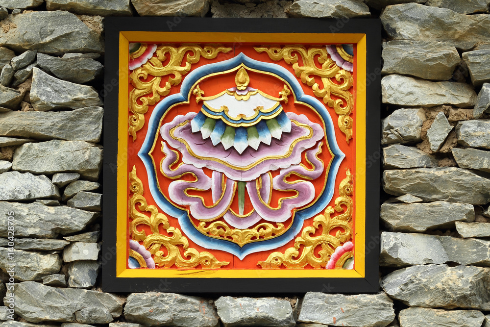 Bhutan style carved wood on stone wall