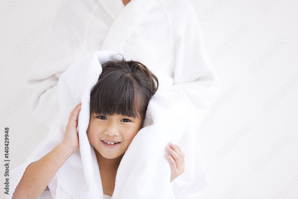 Mother wiping daughter's hair Mother wiping daughter's hair