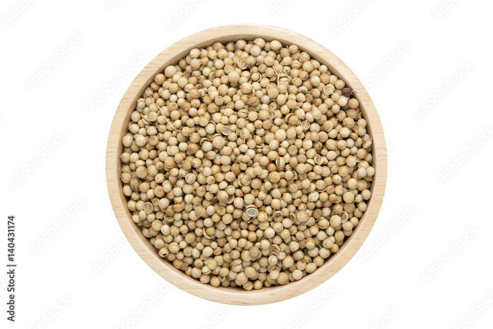 coriander seeds in wooden bowl isolated top view on white coriander seeds in wooden bowl isolated top view on white