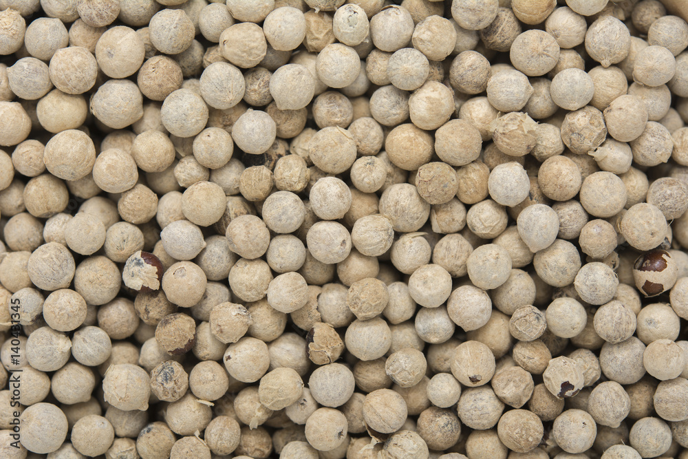 White peppercorns background