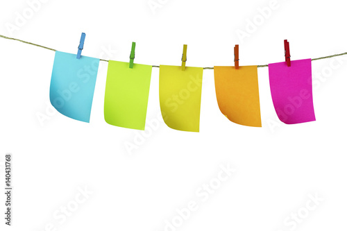 Sticky notes hanging by clothespin with white background