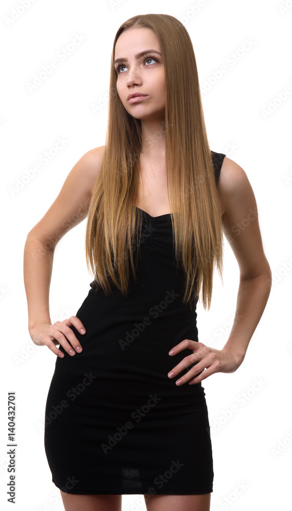 Serious girl looking up with her hands on hips Serious girl looking up with her hands on hips