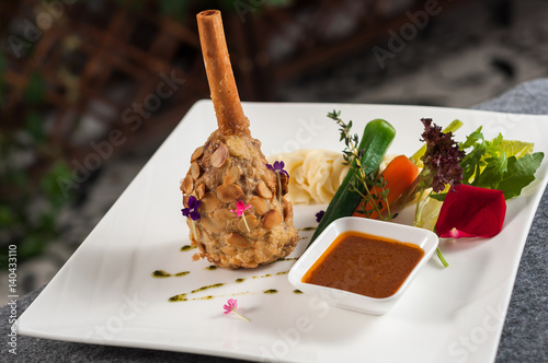 lamb shank with vegetable and gravy photo