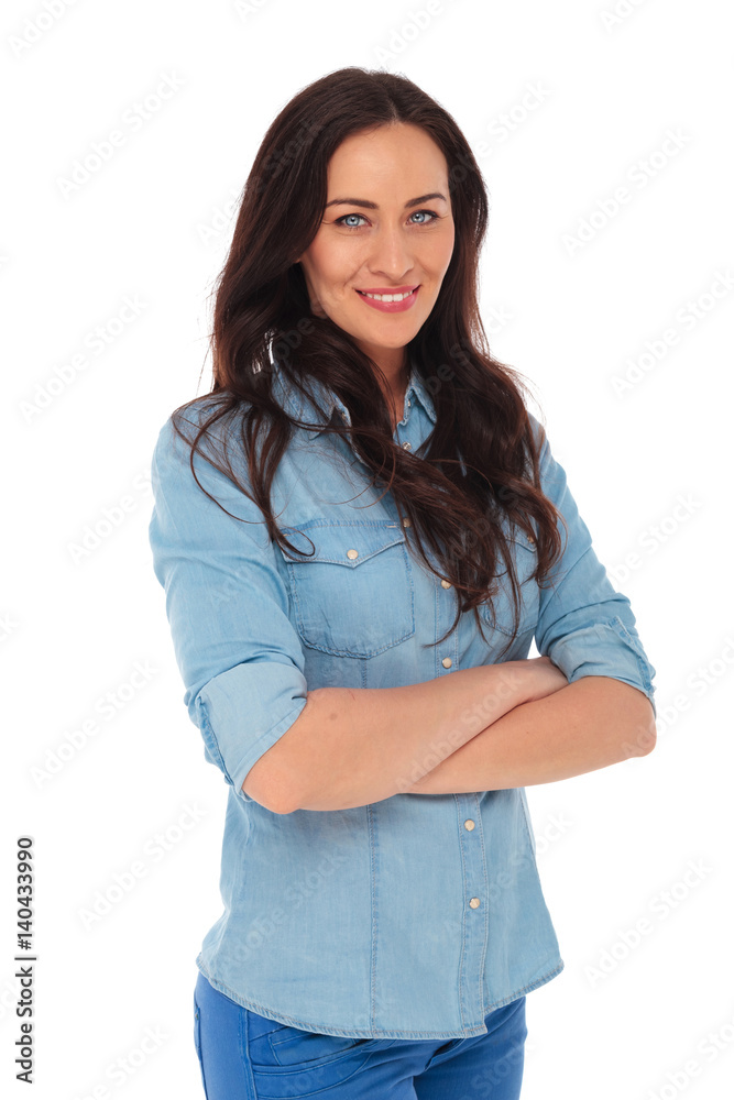 portrait of a confident casual woman standing with hands crossed portrait of a confident casual woman standing with hands crossed