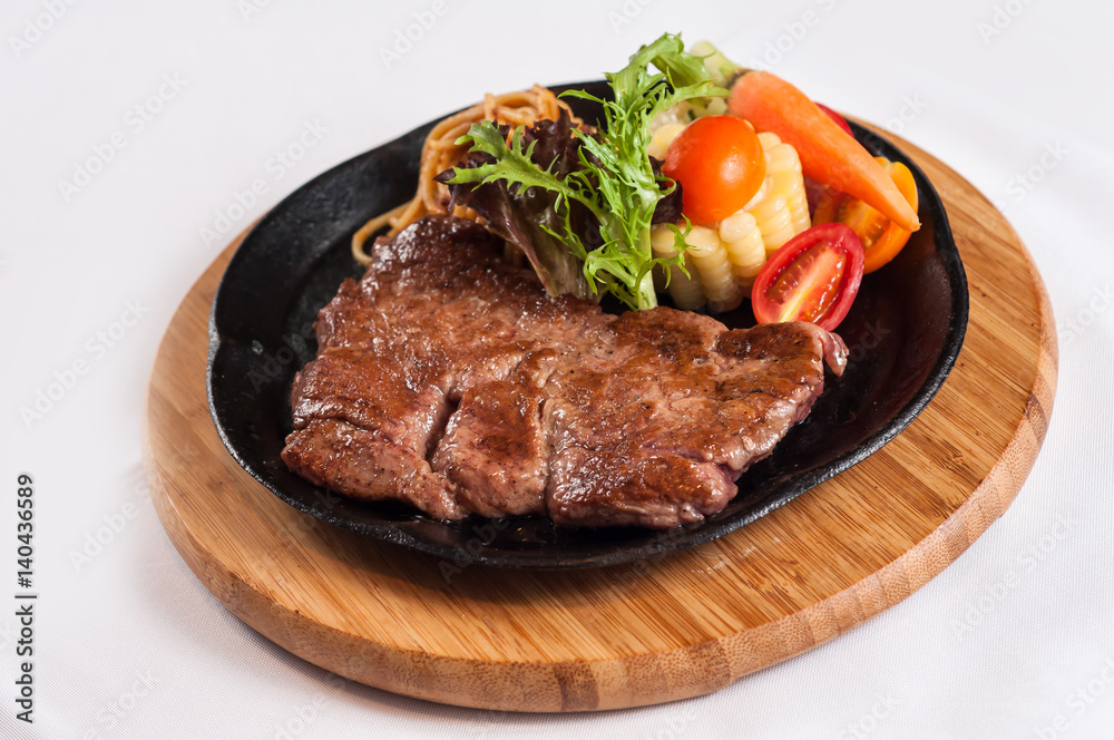 grilled sirloin steak with vegetables and noodles