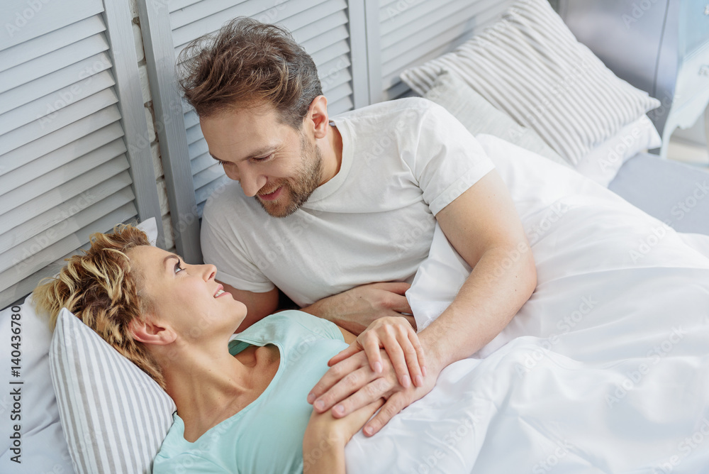 Fototapeta premium Happy family relaxing at home in morning