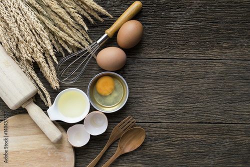 Food ingredients , kitchen utensils for cooking on wooden background photo