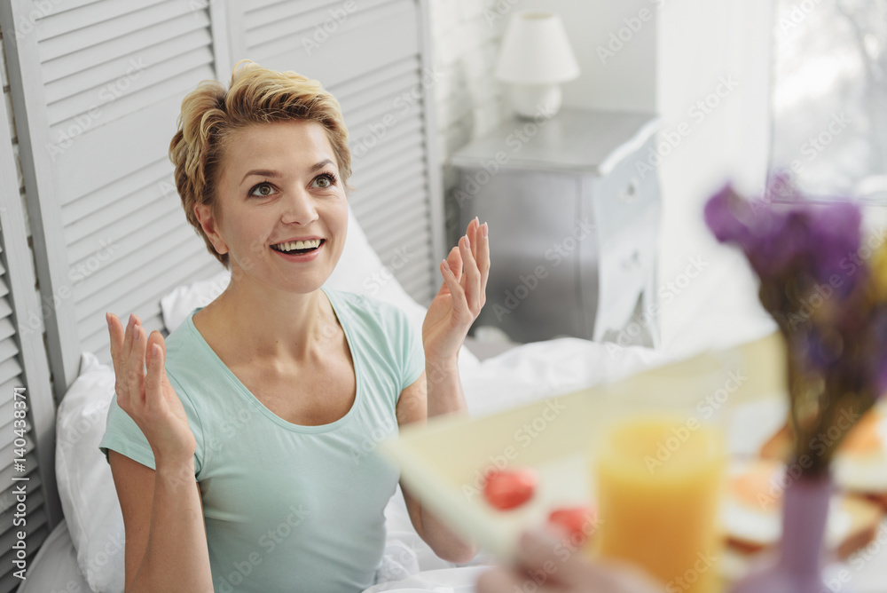 Happy lady taking courtship by her husband in bedroom