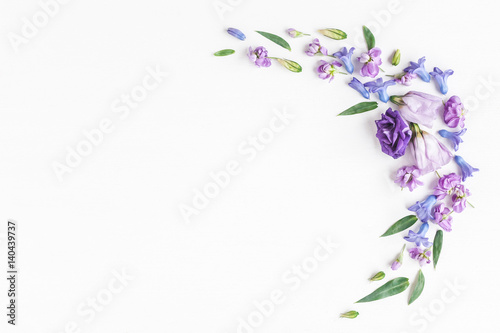 Flowers composition. Frame made of various colorful flowers on white background. Flat lay  top view