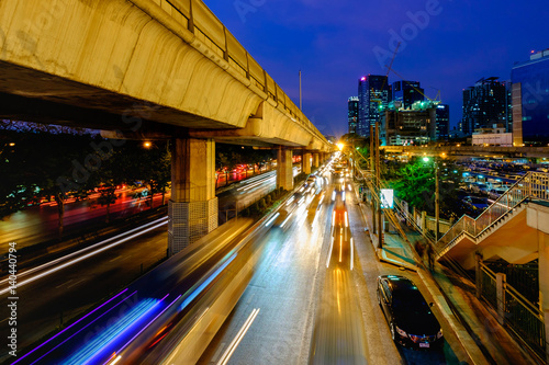 Cityscape of light trails with blurred colors on the street at night