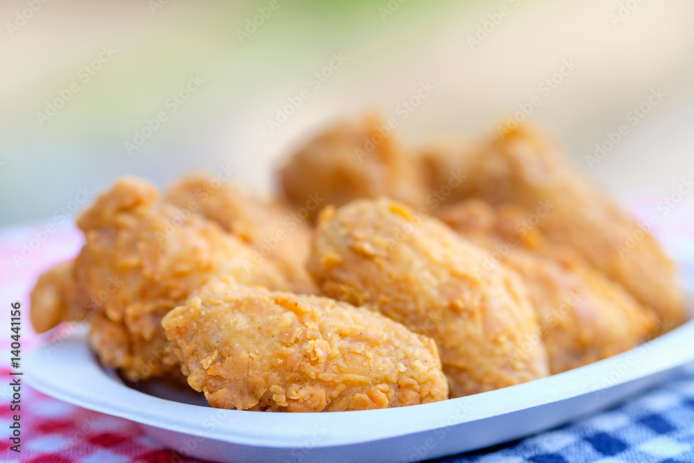 A plate of fresh, hot, crispy fried chicken A plate of fresh, hot, crispy fried chicken