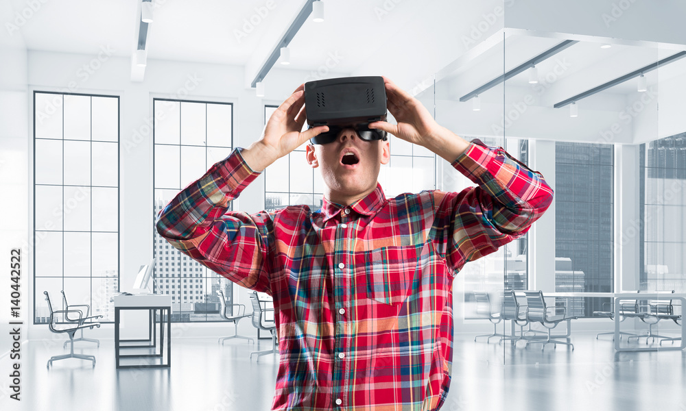 Concept of modern entertaining technologies with man wearing virtual reality mask