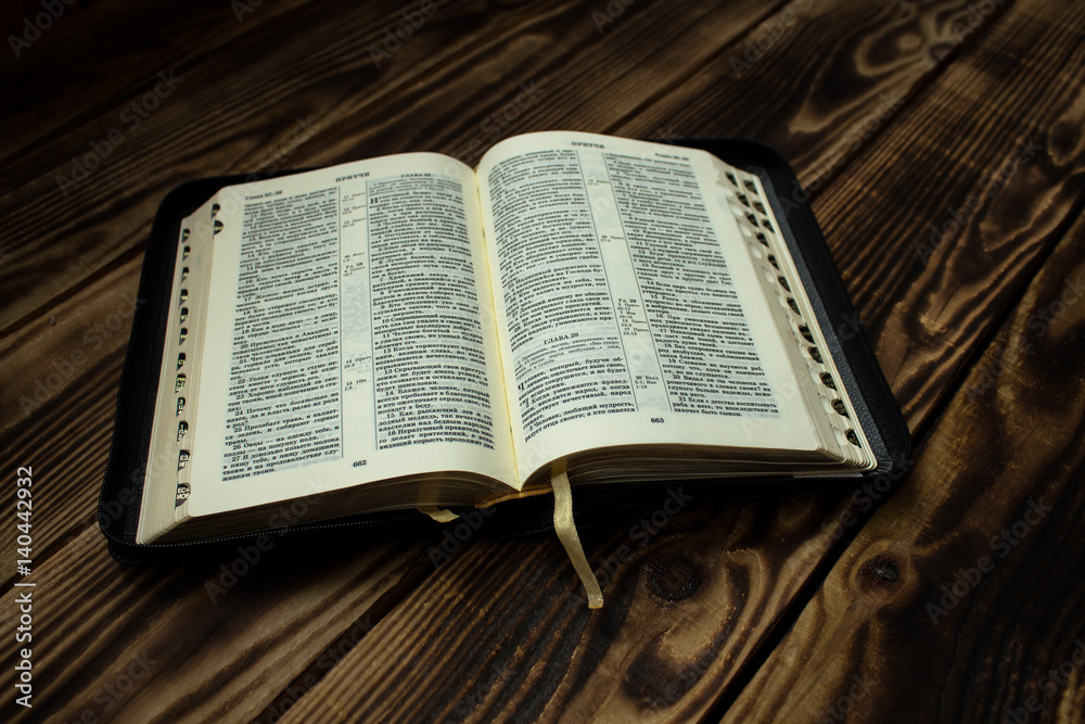 Fototapeta premium Bible on wooden board