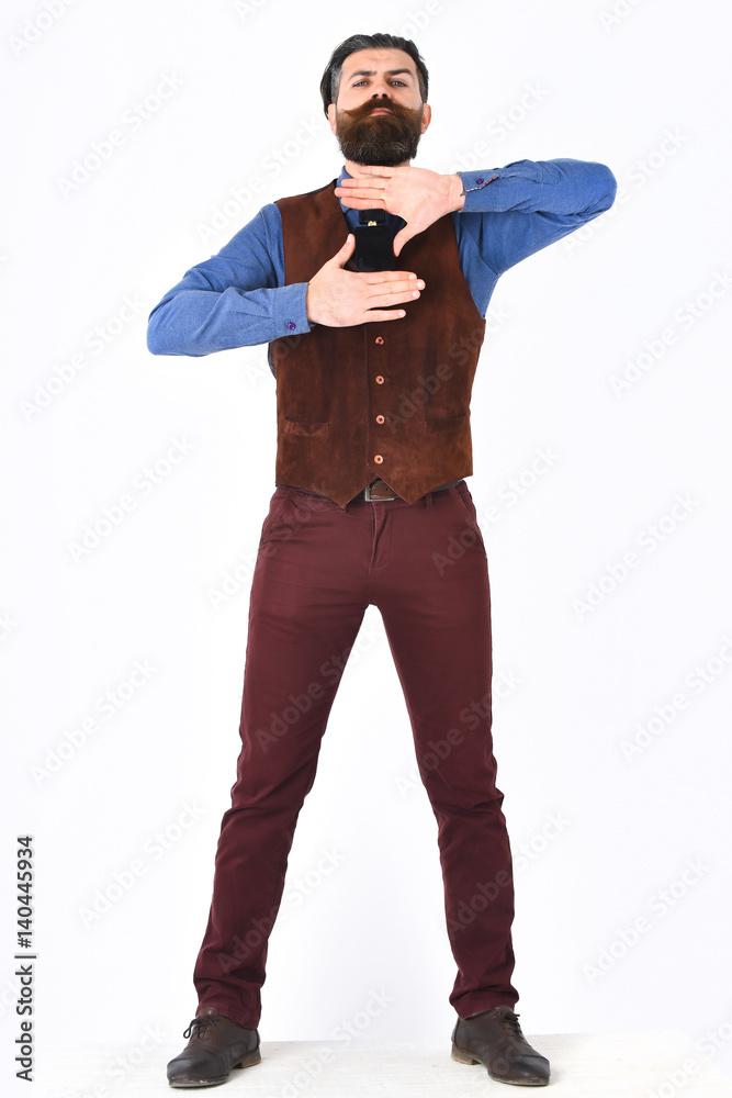 bearded man holding perfume with serious face bearded man holding perfume with serious face