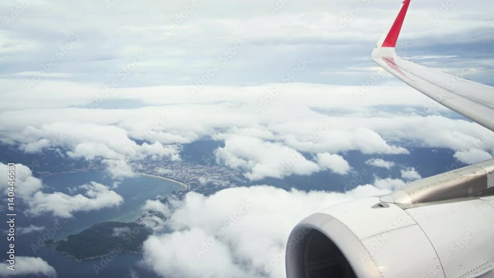 Passenger Perspective of Patong Beach, Thailand, with Airplane Engine and Wing Passenger Perspective of Patong Beach, Thailand, with Airplane Engine and Wing