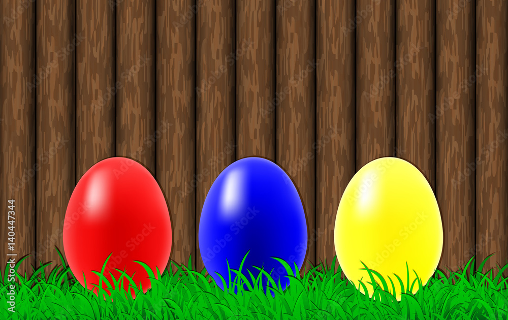 Easter eggs on a wooden wall background